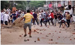 Riotous - Marked by or involving public disorder. / characterized by wild and uncontrolled behavior.