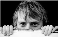 Lurk - To be concealed but capable of being discovered/ to move furtively or Inconspicuously/ Be Or Remain Hidden.