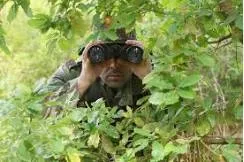 Reconnaissance  - (Observation of a region to locate an enemy or ascertain strategic features. (especially for military))