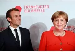 Macron  merkel pledge common roadmap on eurozone reforms