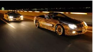 Ostentatious  - Characterized by pretentious or showy display.