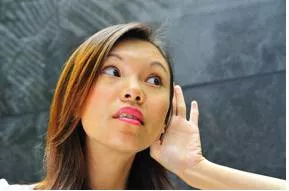 Muffled - Sound that is quiet or not clear.