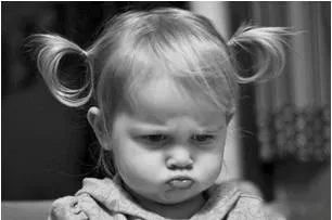 Grumble  - Complain about something in a bad-tempered way.