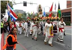 Procession  - A number of people or vehicles moving forward in an orderly fashion, especially as part of a ceremony.