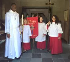 Acolyte  - Anyone who follows or helps another person, or someone who helps apriest in some religious ceremonies.