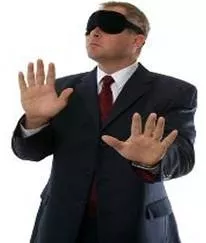 Turn a blind eye  - To ignore something and pretend you do not see it.