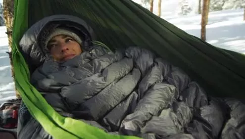 Cocooned - Envelop or surround in a protective or comforting way.