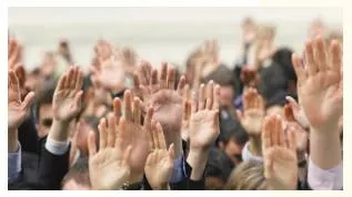 Unanimously  - Meaning: with the agreement of all people involved.