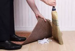 Paper over - To try to hide a problem or disagreement in a way that is temporary and not likely to be successful.