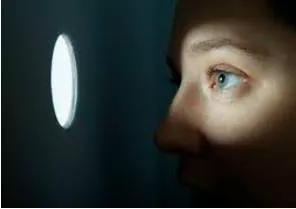 Lurk  - Meaning- To wait somewhere secretly, especially because you are going to do something bad or illegal.
