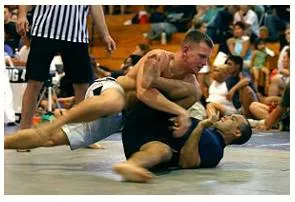 Grapple  - Struggle to deal with or overcome (a difficulty or challenge).