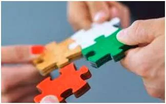 Piecemeal  - Done or happening gradually at different times and often in different ways, rather than carefully planned at the beginning.