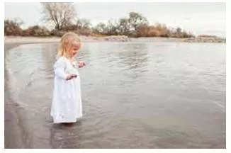 Wade  - Walk through (something filled with water).