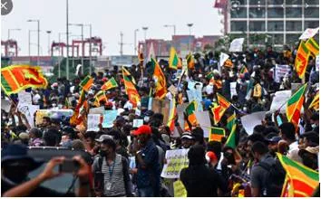Outcry - A reaction of anger or strong protest shown by people in public.