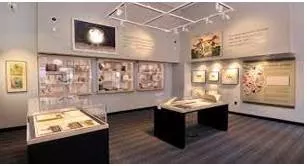 Exhibit  - to show something in a public place for people to enjoy or to give them information
