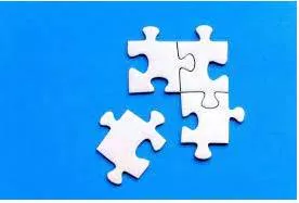 Piecemeal - Done or happening gradually at different times and often in different ways, rather than carefully planned at the beginning.