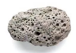 Porous - Having many small holes that allow water or air to pass through slowly.