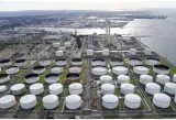Oil stable near $100 a barrel as dollar weakens