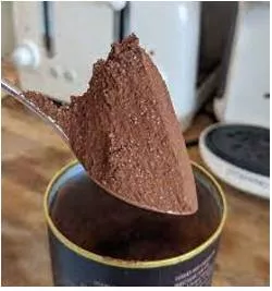 Heaped  - used to describe a spoon, etc. that has as much in it or on it as it can hold.