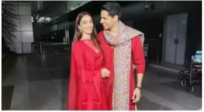 Newlyweds sidharth malhotra and kiara advani twin in red as they walk out of airport holding hands  pose for paparazzi