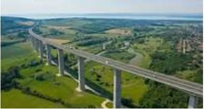 Viaduct - A long bridge-like structure, typically a series of arches, carrying a road or railway across a valley or other low ground.