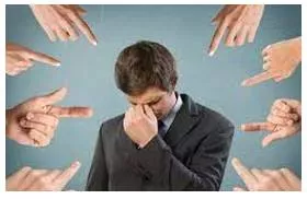 Accusing - A person or group of people who are charged with or on trial for a crime.