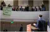 Protesters disrupt macron speech on dutch state visit
