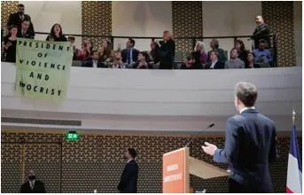 Protesters disrupt macron speech on dutch state visit