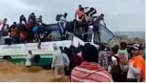 Watch  uttarakhand bus tries to cross river with heavy flow  passengers jump out