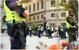 Two men set fire to koran during protest outside swedish parliament