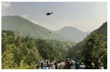Rescuers save all eight people from cable car dangling above canyon in pakistan
