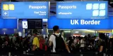 U k  tightens immigration rules to curb record high migrant numbers