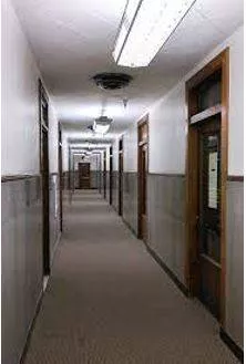 Corridor - A long passage in a building from which doors lead into rooms.
