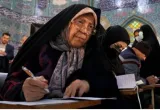 Iranians vote in parliament election as conservatives try to tighten their grip
