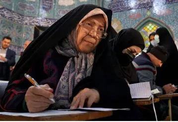 Iranians vote in parliament election as conservatives try to tighten their grip