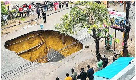 Sp questions bjp’s vikas model after lucknow road caves in