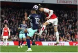 Arsenal stays at the top after liverpool holds man city