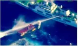 Chinese forces hit filipino boat with water cannons