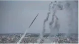 Hezbollah fires scores of rockets at northern israel as gaza cease fire talks hang in the balance