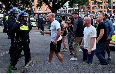 U k  grapples with worst riots in 13 years spurred by far right