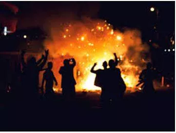 Rioting - Noisy, violent, and uncontrolled behaviour by a group of people in a public place, often as a protest.