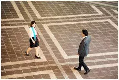 Hovers - To stand somewhere, especially near another person, eagerly or nervously waiting for their attention. (मंडराना) 