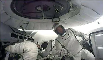 Billionaire steps out of spacex capsule for first private spacewalk