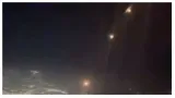 Chilling video from british airways flight's cockpit shows iran's missiles flying over israel