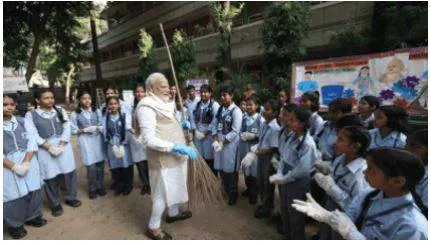 10 years of swachh bharat  pm modi picks up the broom for cleanliness drive with 'young friends'
