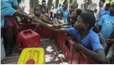 Over 6 000 people in haiti leave their homes after gang attack killed dozens