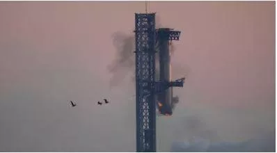 In a first  spacex successfully 'catches' megarocket booster after test flight