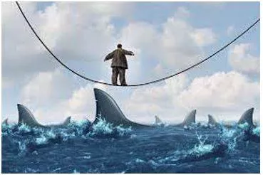Vulnerable - Exposed to the possibility of being attacked or harmed, either physically or emotionally. (असुरक्षित)