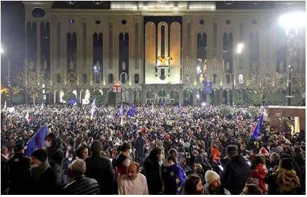 Georgian protesters rally on second night after suspension of eu talks
