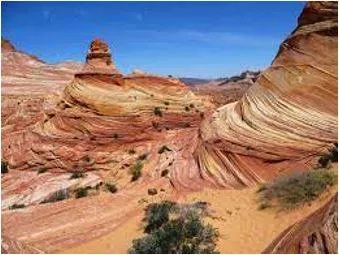 Eroding - Gradually wear away (soil, rock, or land).